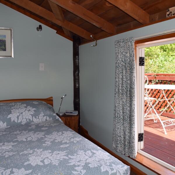 Mahoe Bed and view through doors copy